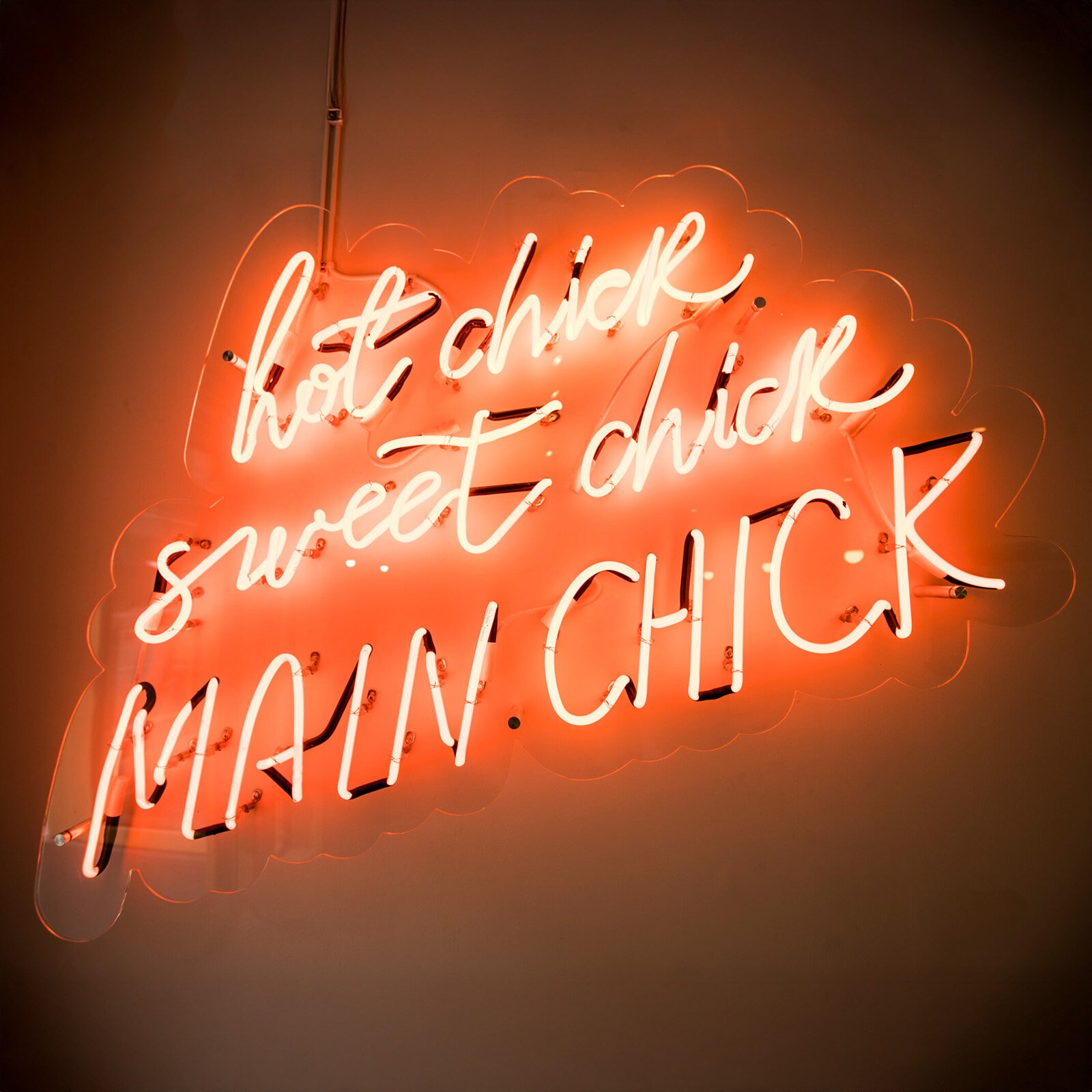 Genius Signs technician servicing a custom Super Cup neon sign mounted inside a restaurant