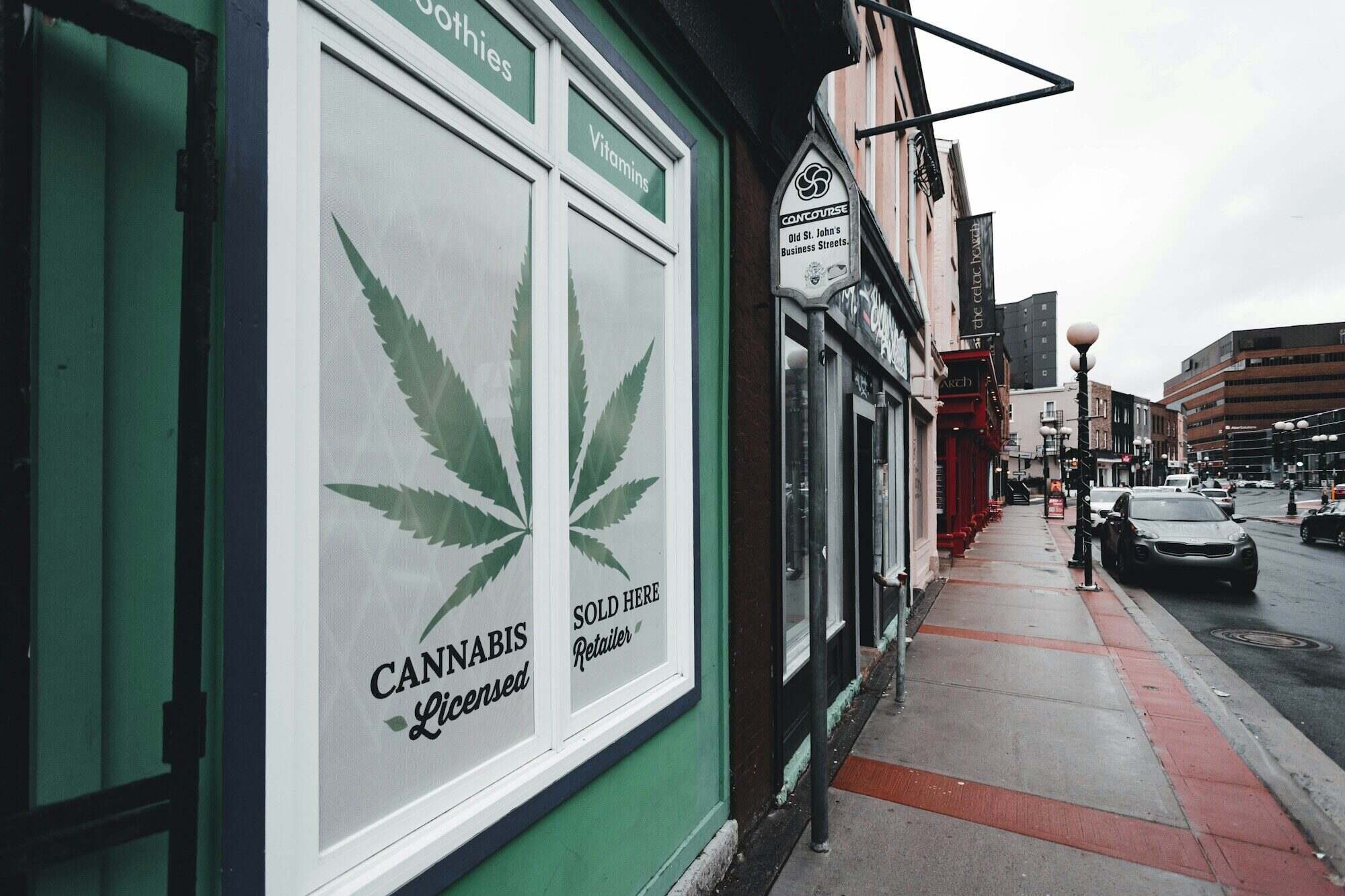 Cannabis dispensary storefront with branded facade graphics