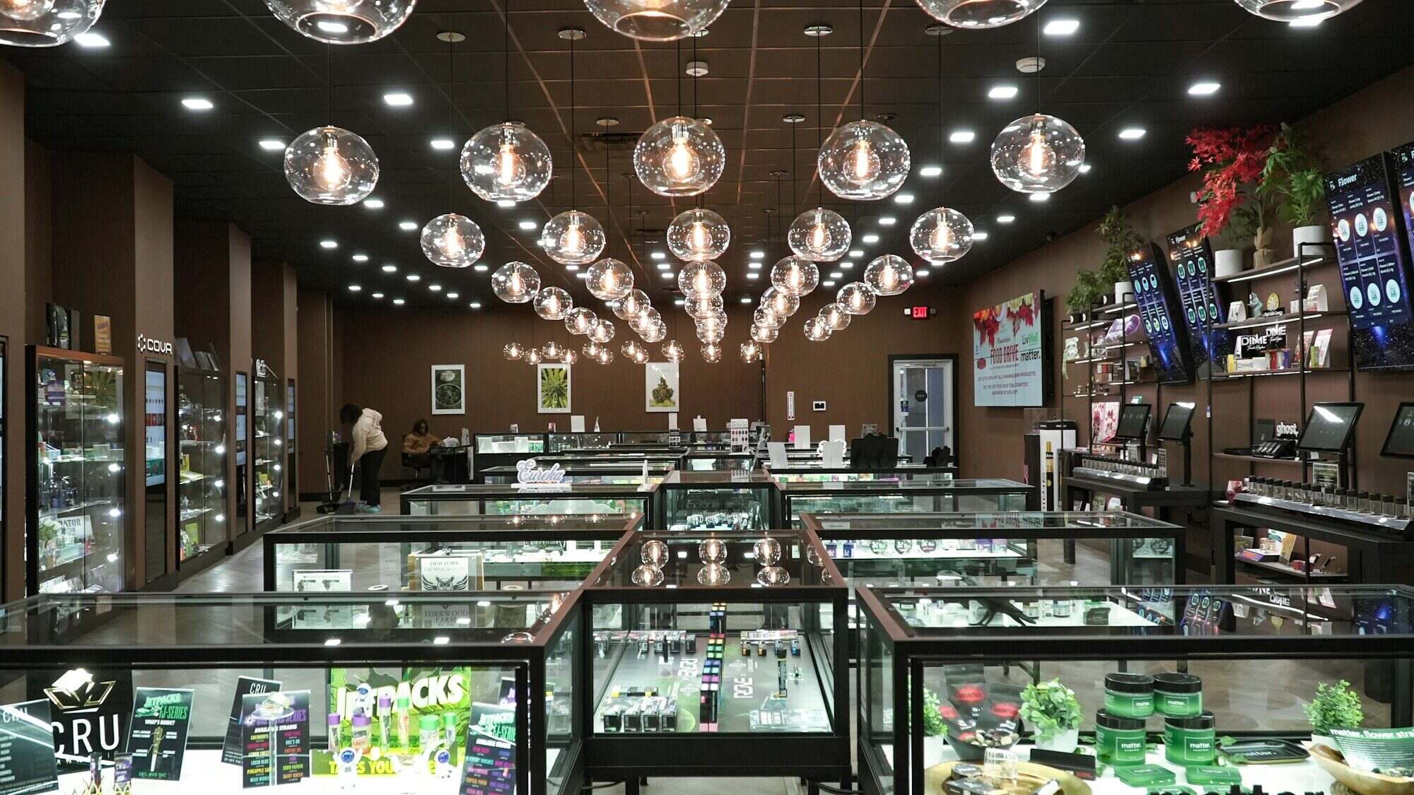 Modern dispensary retail interior with display cases and illumination