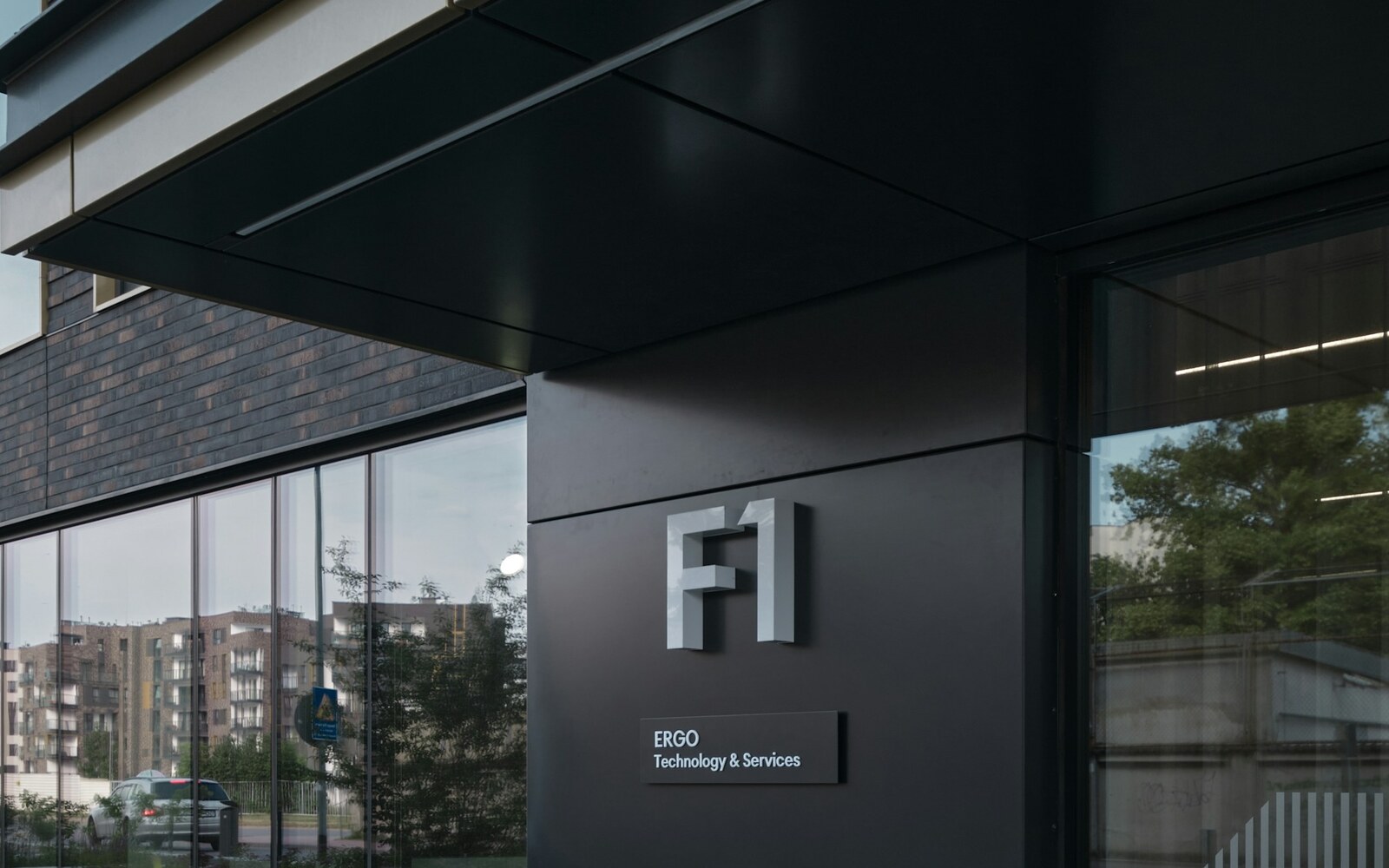 Modern office building exterior with tenant identification signage