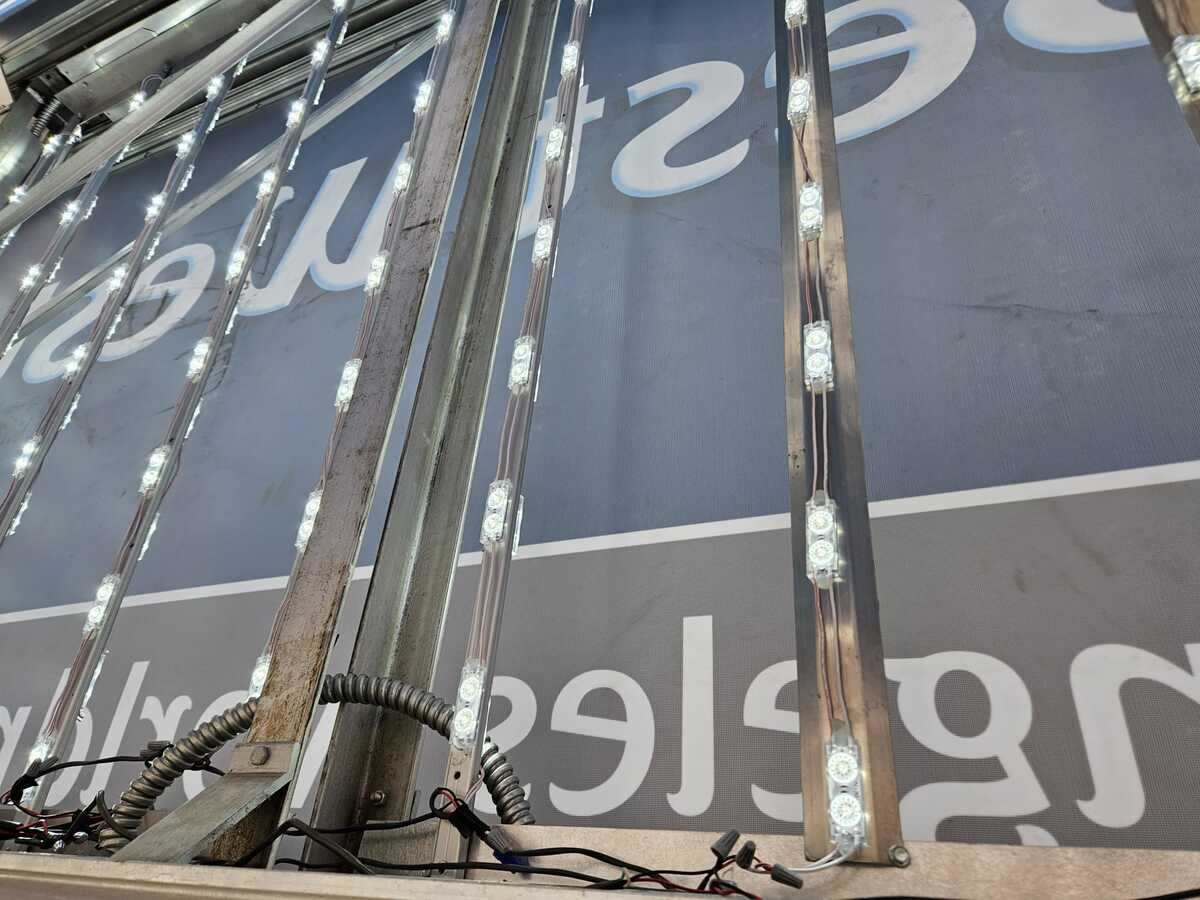 Edge lit channel letter interior showing bright LED strip arrays mounted inside the cavity