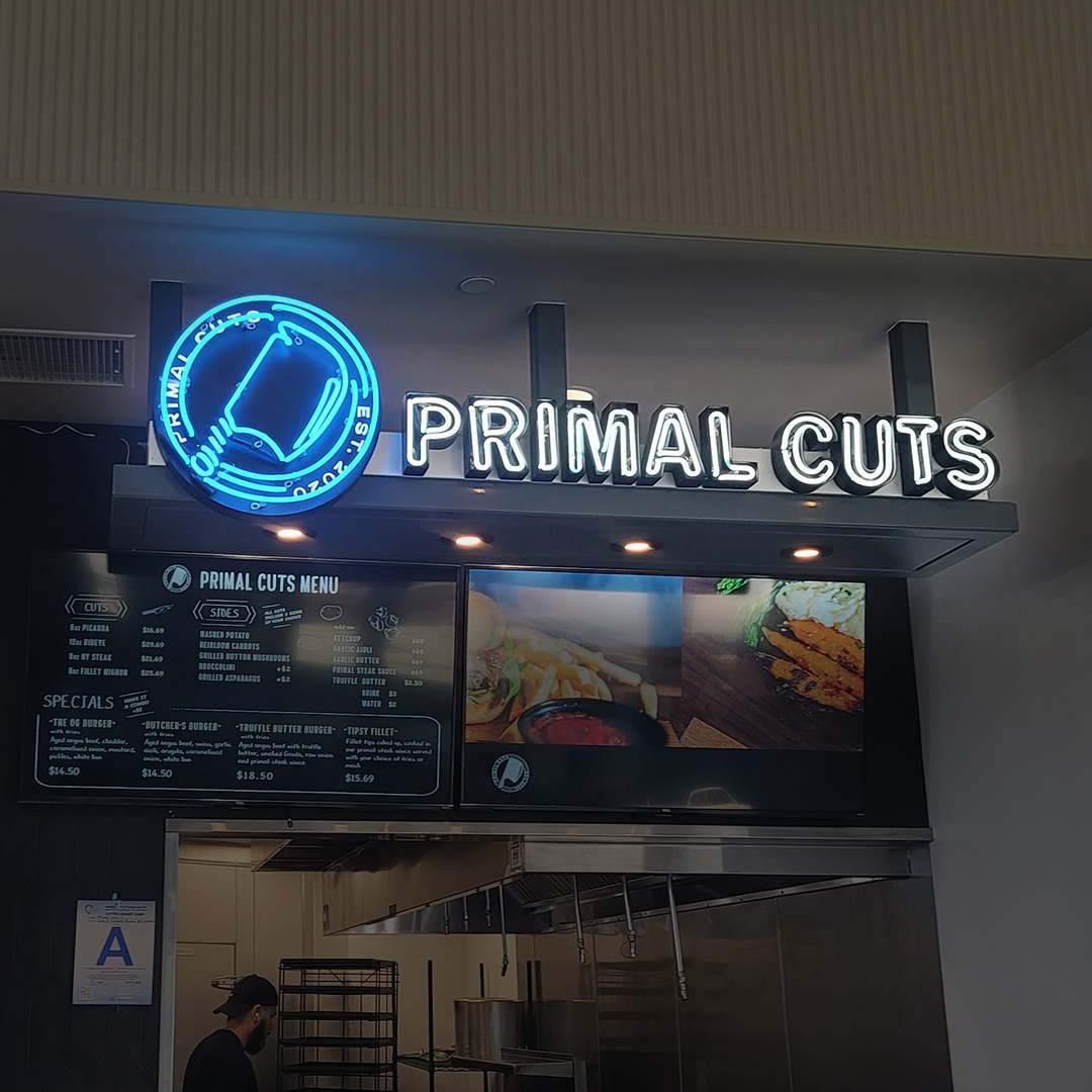 Illuminated channel letter sign installed on a Los Angeles storefront — Primal Cuts