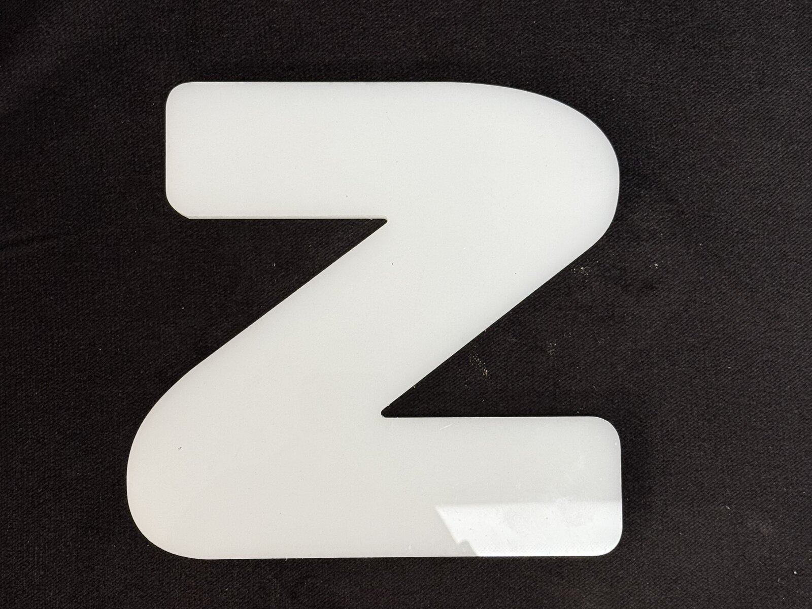 Flat-cut acrylic dimensional letters ½ inch thick, shop-floor sample