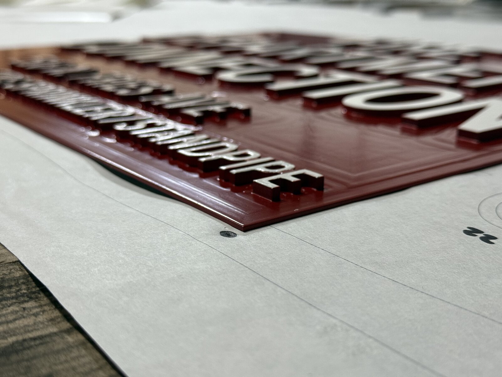 Flat-cut aluminum letters mounted with concealed pin standoffs on a commercial exterior wall