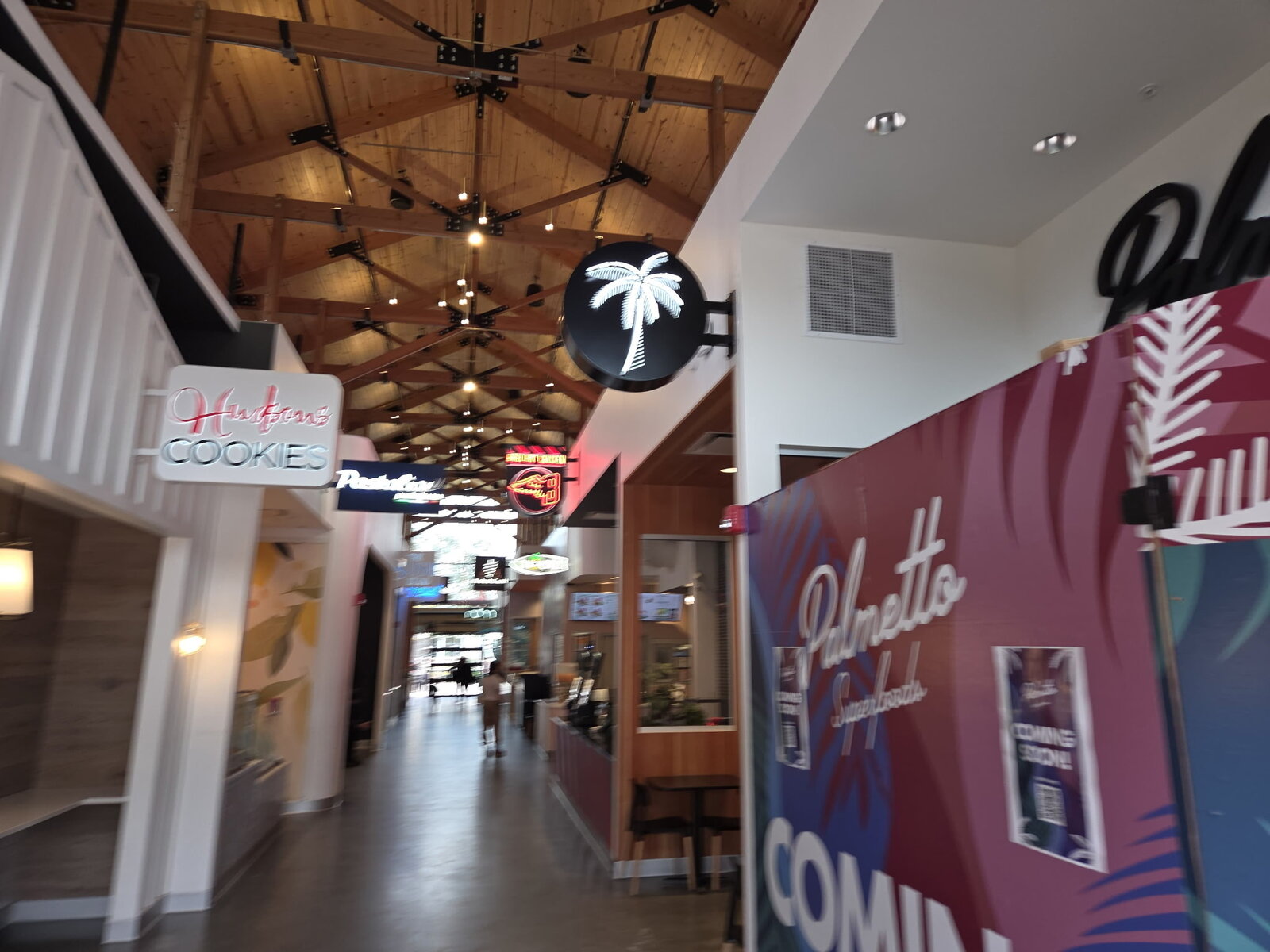 Painted aluminum cabinet sign installed on a commercial building exterior