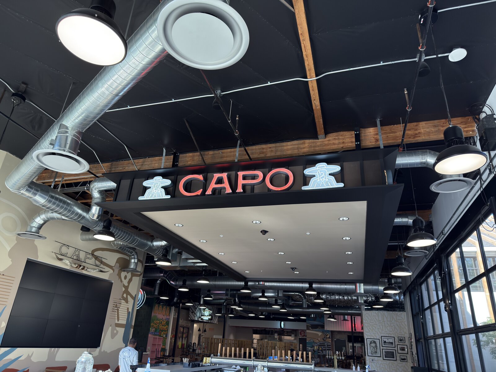 Open channel letters with exposed LED neon on a hospitality facade