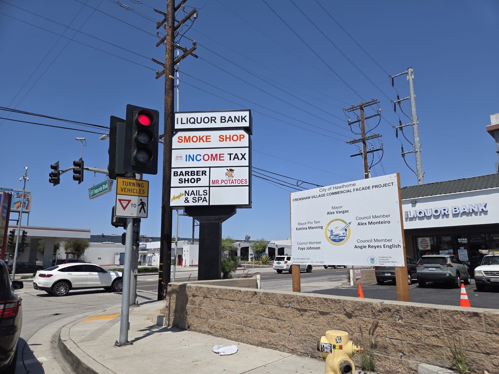 Roadside pole sign with illuminated cabinet on a Los Angeles arterial