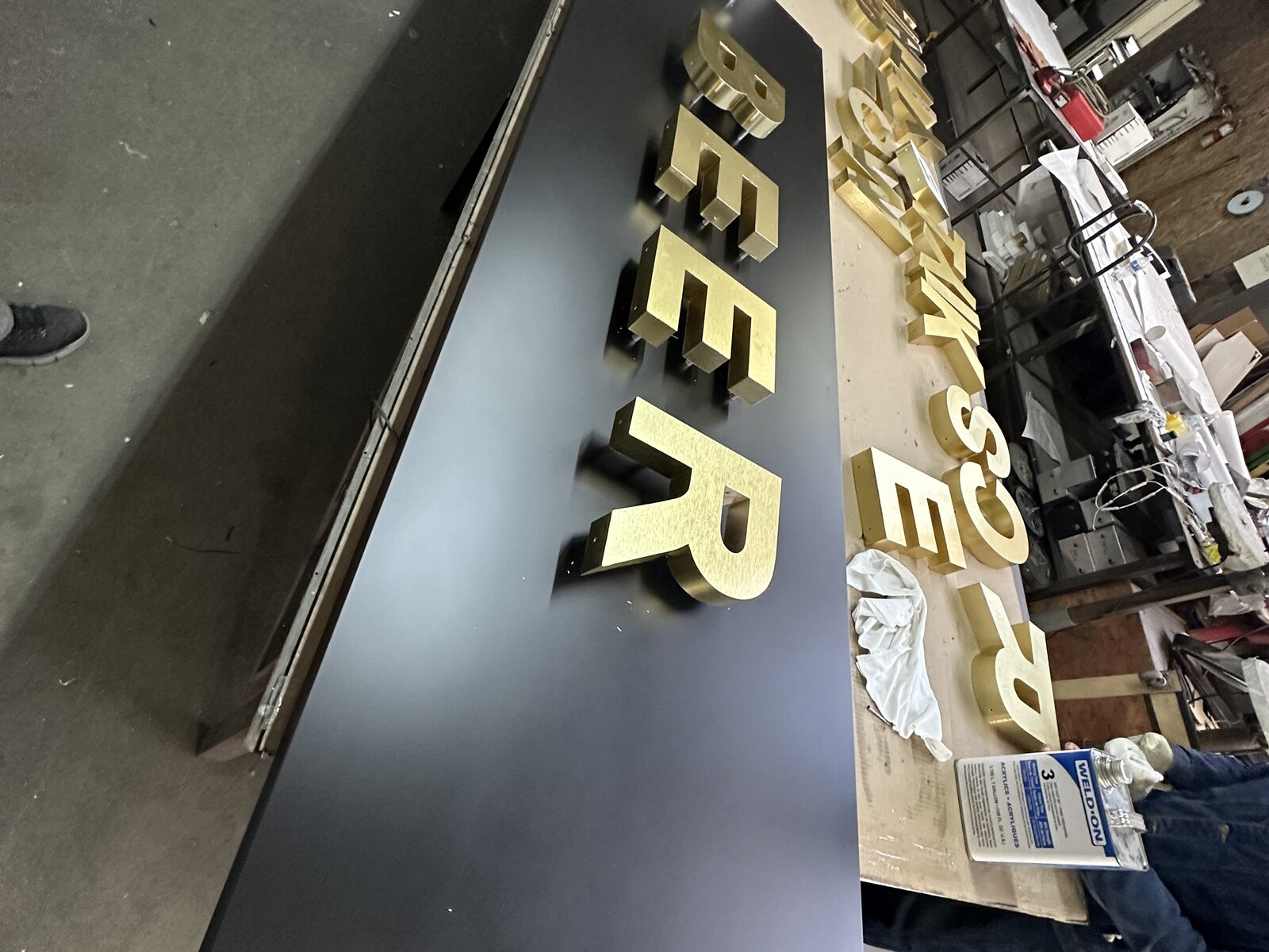 Reverse channel letters with premium metal faces at dusk on a luxury property