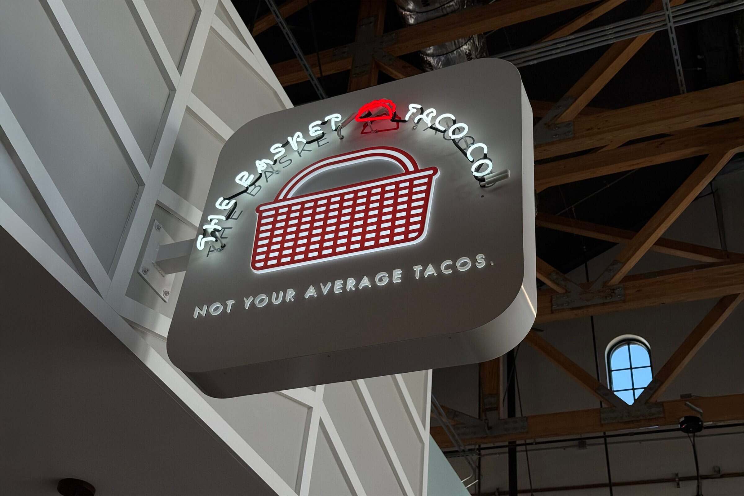 Blade sign projecting perpendicular from a Los Angeles storefront facade