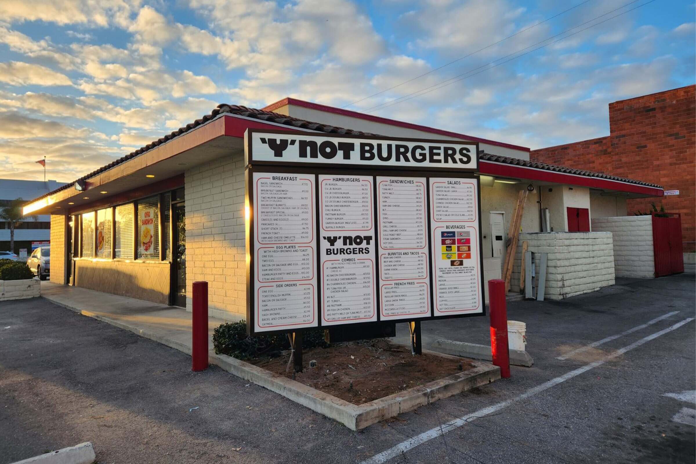 Drive-thru menu board with breakfast, burgers, and combo menus at Y'Not Burgers, installed by Genius Signs