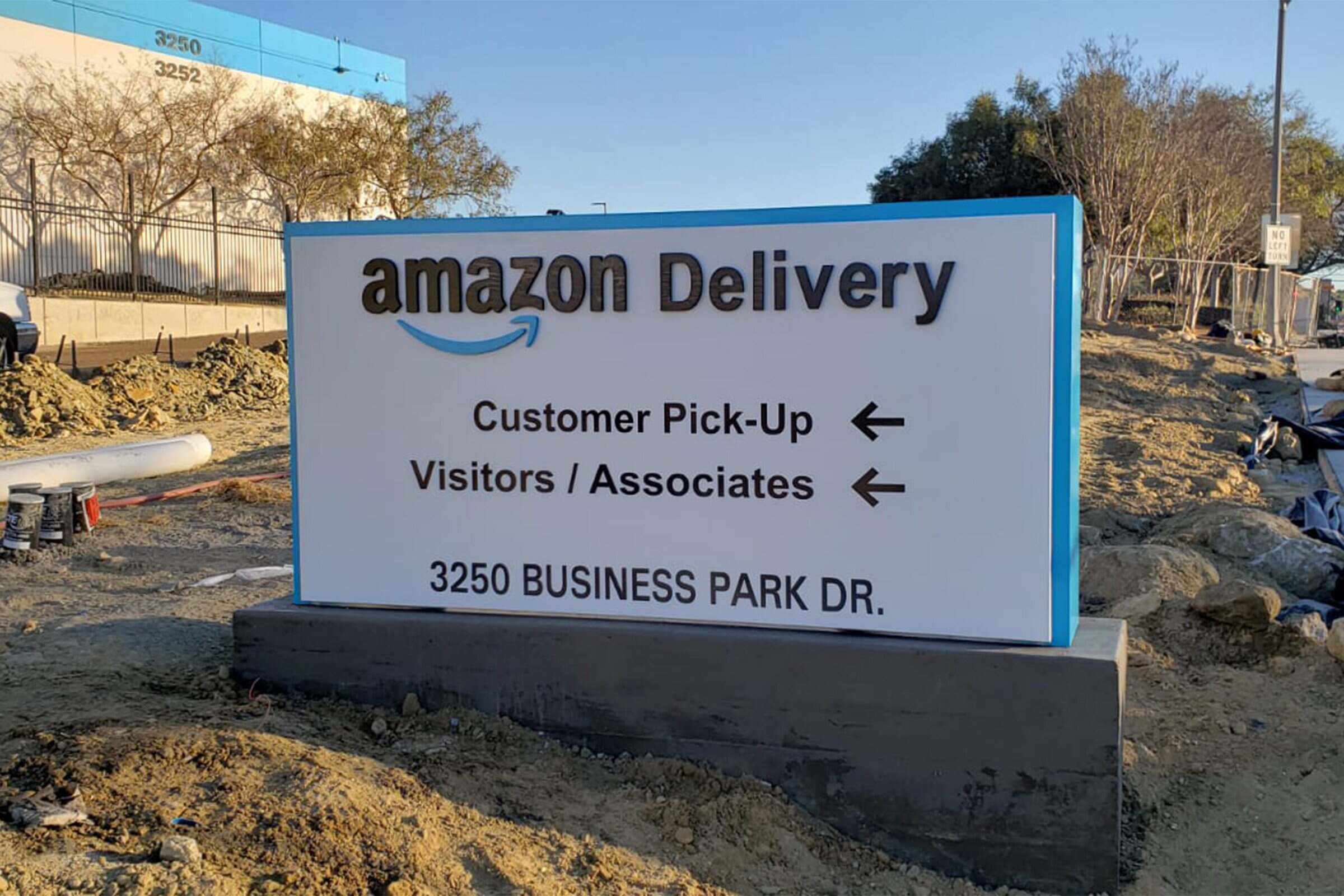 Ground-level monument sign installed at a commercial property entrance