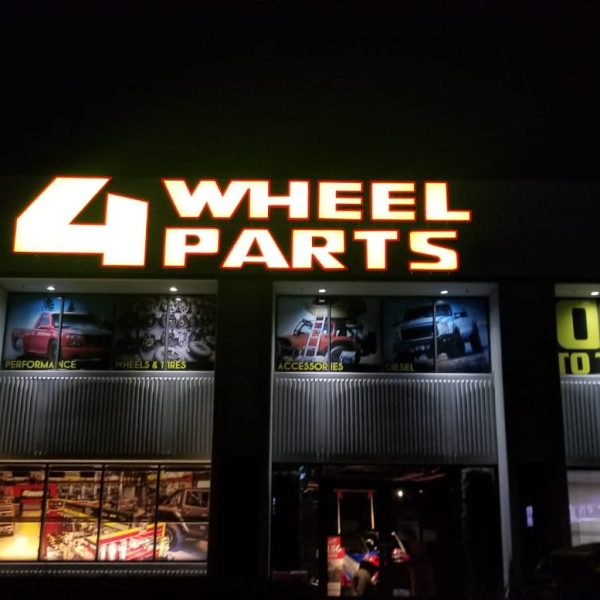 4Wheel Parts Front Lit Channel Letter Sign at Night Time