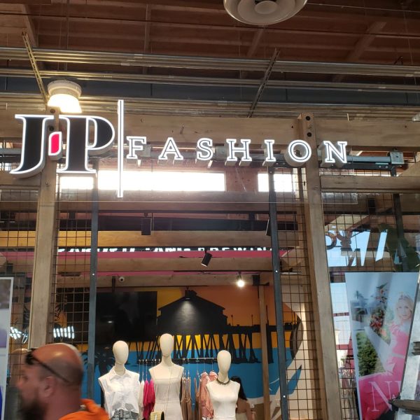 JP Fashion Front Lit Signage installed on Wood Post inside Malll